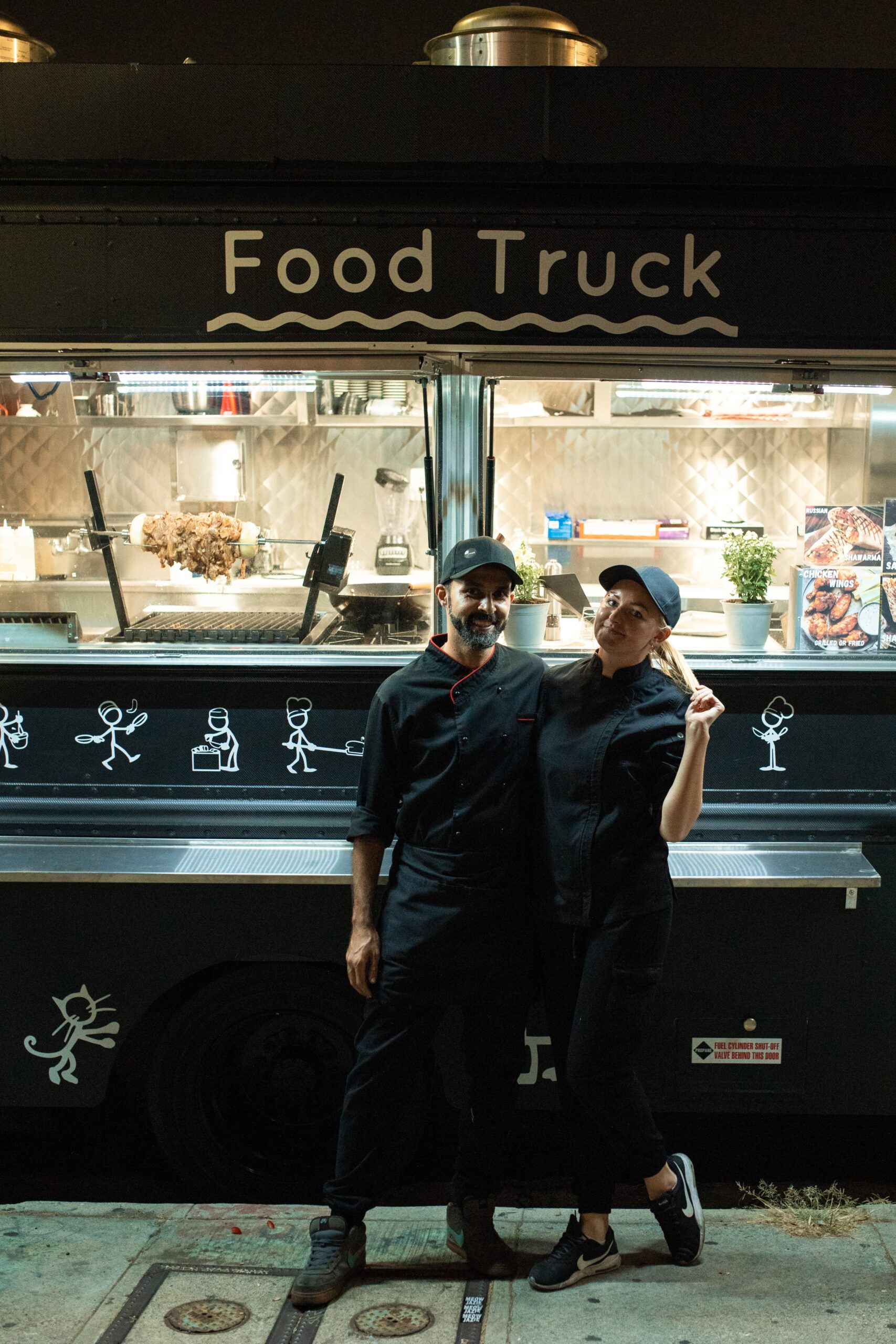 food truck owners standing in front of truck